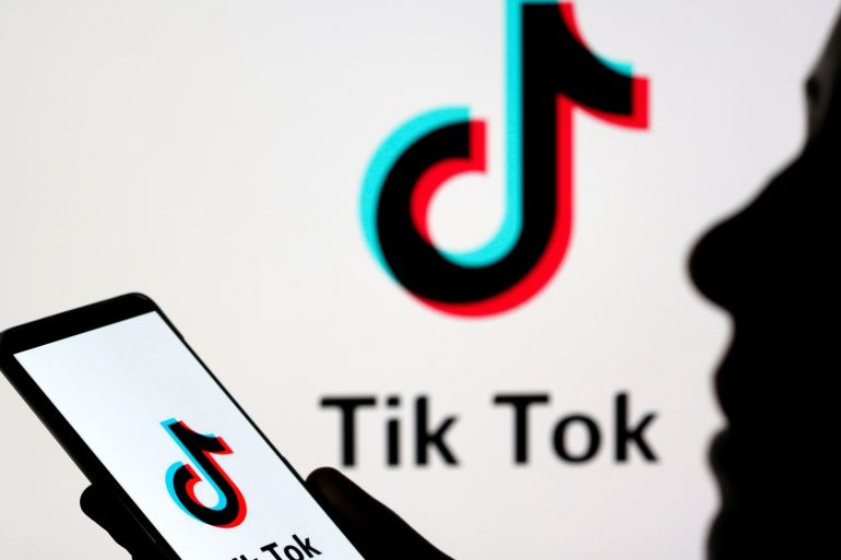 A person holds a smartphone with Tik Tok logo displayed in this picture illustration taken November 7, 2019. Picture taken November 7, 2019. REUTERS/Dado Ruvic/Illustration
