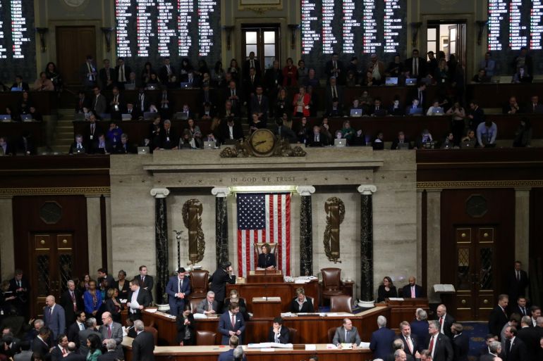 A tote board shows the votes of members of Congress as U.S. Speaker of the House Nancy Pelosi (D-CA) presides over the final of two House of Representatives votes approving two counts of impeachment against U.S. President Donald Trump in the House Chamber of the U.S. Capitol in Washington, U.S., December 18, 2019. REUTERS/Jonathan Ernst