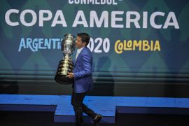 CARTAGENA, COLOMBIA - DECEMBER 03: Former Brazilian player Juninho Paulista holds the Copa America trophy during the draw for Copa America 2020 co-hosted by Argentina and Colombia at Centro de Convenciones de Cartagena de Indias on December 03, 2019 in Cartagena, Colombia. (Photo by Guillermo Legaria/Getty Images)