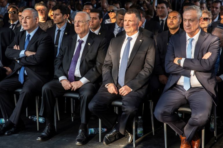Israeli Prime Minister Benjamin Netanyahu, President Reuven Rivlin and head of Blue and White Party Benny Gantz attend a memorial ceremony for the late prime minister Yitzhak Rabin at Mount Herzl military cemetery in Jerusalem as Israel marks the 24th anniversary of Rabin's killing by an ultra-nationalist Jewish assassin, November 10, 2019. Heidi Levine/Pool via REUTERS