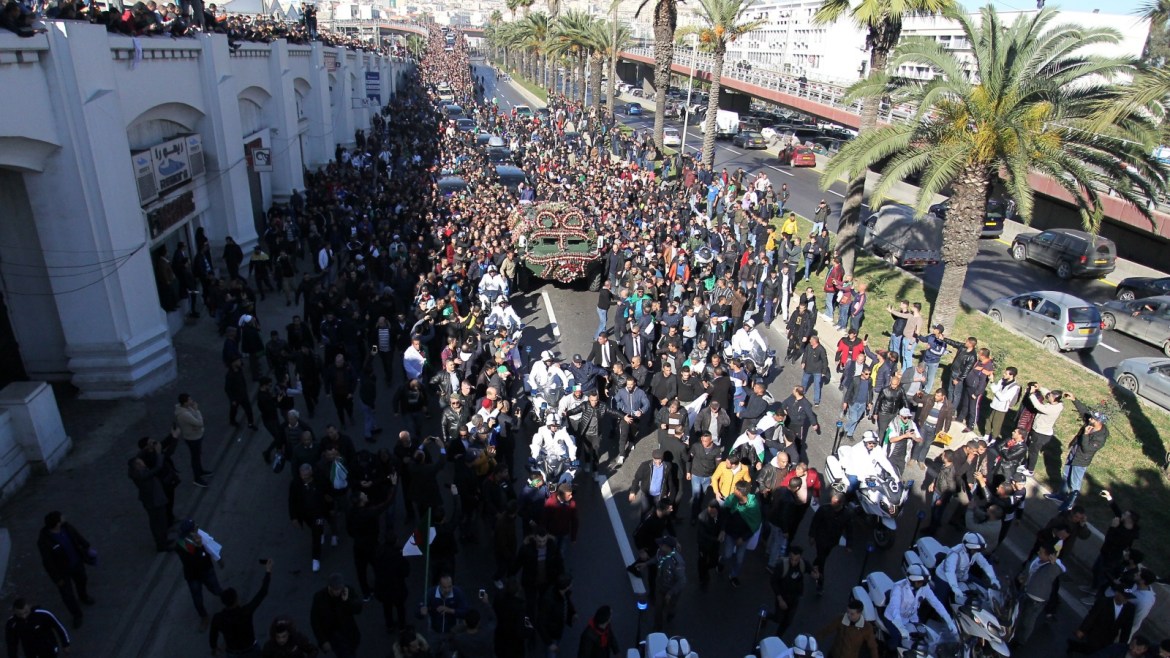 fff People walk in a funeral procession of Algeria's military chief Lieutenant general Ahmed Gaed Salah in Algiers,