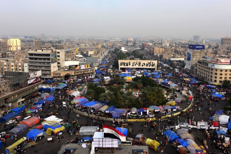 epaselect epa08075907 Iraqi protesters gather during the ongoing protests at the Al Tahrir square in central Baghdad, Iraq, 16 December 2019. Protests continue in Baghdad and southern Iraqi cities since October 2019 with rising casualties of more than 300 people, while protesters are calling for the resignation of all senior officials in the country after Prime Minister Adel Abdul Mahdi stepped down. EPA-EFE/MURTAJA LATEEF