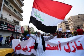 epaselect epa08033213 Iraqi protesters carry the Iraqi national flag and shout slogans shortly after the resignation of Iraqi Prime Minister Adel Abdel-Mahdi, as they take part in the ongoing protests at the Al Tahrir square in central Baghdad, Iraq, 29 November 2019. Iraqi Prime Minister Adel Abdel-Mahdi said 29 November 2019 he will present his resignation to parliament after a day of particularly deadly violent protests. According to reports, at least 46 anti-government protesters have been killed in clashes with security forces in the past 24-hour in the southern city of Nasiriyah and Najaf. EPA-EFE/MURTAJA LATEEF