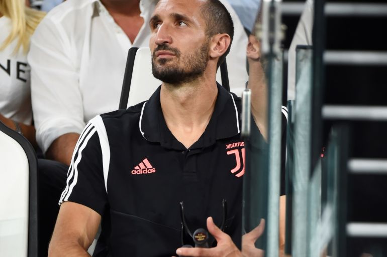 Soccer Football - Serie A - Juventus v Napoli - Allianz Stadium, Turin, Italy - August 31, 2019 Juventus' Giorgio Chiellini looks on from the stand holding crutches and wearing protective knee wear REUTERS/Massimo Pinca