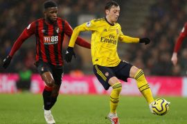 Soccer Football - Premier League - AFC Bournemouth v Arsenal - Vitality Stadium, Bournemouth, Britain - December 26, 2019 Arsenal's Mesut Ozil in action with Bournemouth's Jefferson Lerma Action Images via Reuters/John Sibley EDITORIAL USE ONLY. No use with unauthorized audio, video, data, fixture lists, club/league logos or