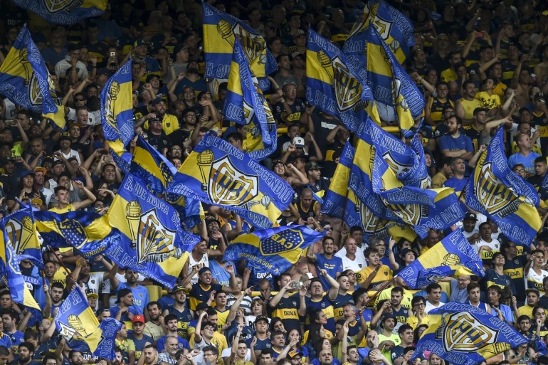 BUENOS AIRES, ARGENTINA - NOVEMBER 30: Fans of Boca Juniors cheer for their team during a match between Boca Juniors and Argentinos Juniors as part of Superliga 2019/20 at Estadio Alberto J. Armando on November 30, 2019 in Buenos Aires, Argentina. (Photo by Marcelo Endelli/Getty Images)