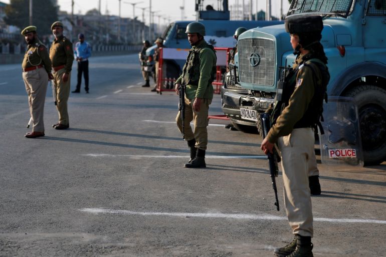 Indian policemen stand guard on a road in Srinagar October 31, 2019. REUTERS/Danish Ismail