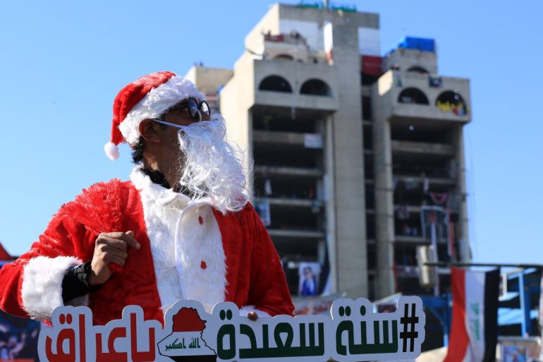 New year preparations in Iraq- - BAGHDAD, IRAQ- DECEMBER 28: An activist dressed up as Santa Claus cheers up people at Tahrir Square in Baghdad, Iraq on December 28, 2019.