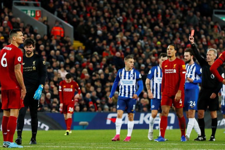 Soccer Football - Premier League - Liverpool v Brighton & Hove Albion - Anfield, Liverpool, Britain - November 30, 2019 Liverpool's Alisson is shown a red card by referee Martin Atkinson Action Images via Reuters/Jason Cairnduff EDITORIAL USE ONLY. No use with unauthorized audio, video, data, fixture lists, club/league logos or