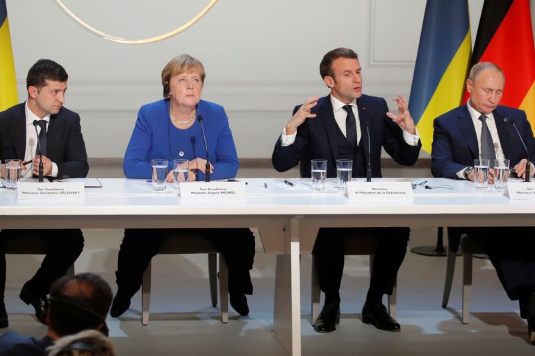 Ukraine's President Volodymyr Zelenskiy, German Chancellor Angela Merkel, French President Emmanuel Macron and Russia's President Vladimir Putin attend a joint news conference after a Normandy-format summit in Paris, France, December 9, 2019. REUTERS/Charles Platiau/Pool?