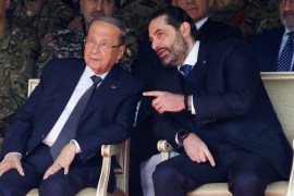 Lebanon's caretaker Prime Minister Saad al-Hariri chats with Lebanon's President Michel Aoun during a military parade to mark the 76th anniversary of Lebanon's independence at the Ministry of Defense in Yarze, Lebanon November 22, 2019. REUTERS/Mohamed Azakir