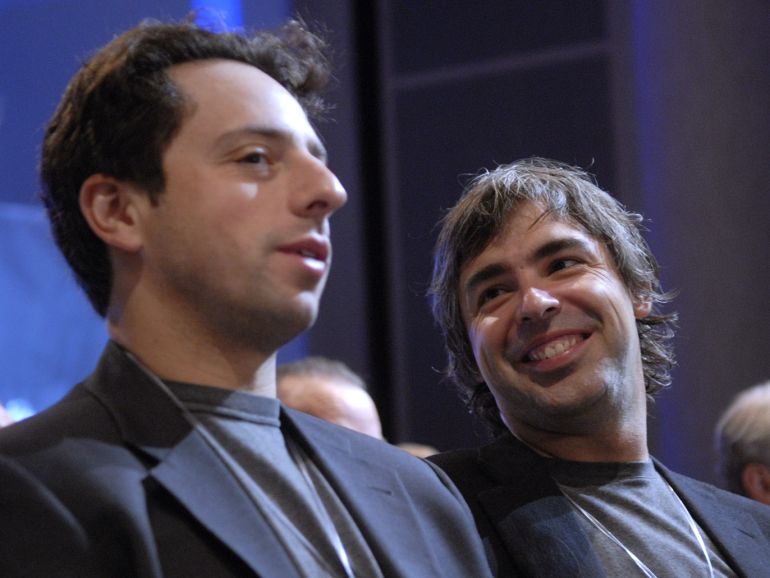 Google founders Larry Page and Sergey Brin are recognized for their efforts at the conclusion of the Clinton Global Initiative in New York, September 22, 2006. Former US President Bill Clinton's annual event brings together world leaders from business, government and philanthropy to try to solve world issues. REUTERS/Chip East (UNITED STATES)