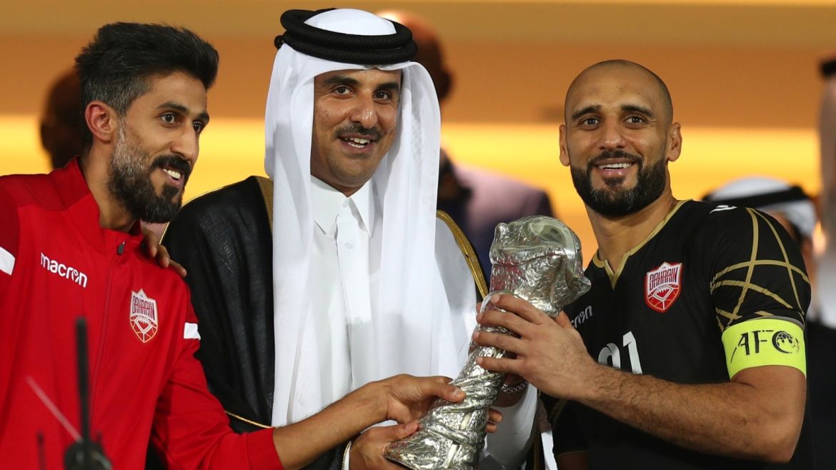 Soccer Football - Gulf Cup - Final - Bahrain v Saudi Arabia - Abdullah bin Khalifa Stadium, Doha, Qatar - December 8, 2019  Emir Sheikh Tamim bin Hamad al-Thani shakes hands with Bahrain's Sayed Mohammed Jaafar after the match   REUTERS/Ibraheem Al Omari
