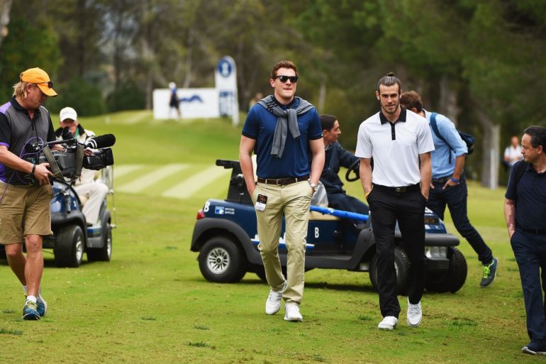 SOTOGRANDE, SPAIN - APRIL 17: Real Madrid and Wales footballer Gareth Bale (2R) walks along the 16th fairway as he watches Sergio Garcia's group on the 16th hole during the final round on day four of the Open de Espana at Real Club Valderrama on April 17, 2016 in Sotogrande, Spain. (Photo by Ross Kinnaird/Getty Images)