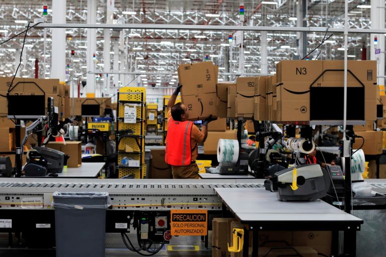 An employee is seen at the new Amazon warehouse during its opening announcement on the outskirts of Mexico City, Mexico July 30, 2019. Picture taken July 30, 2019. REUTERS/Carlos Jasso