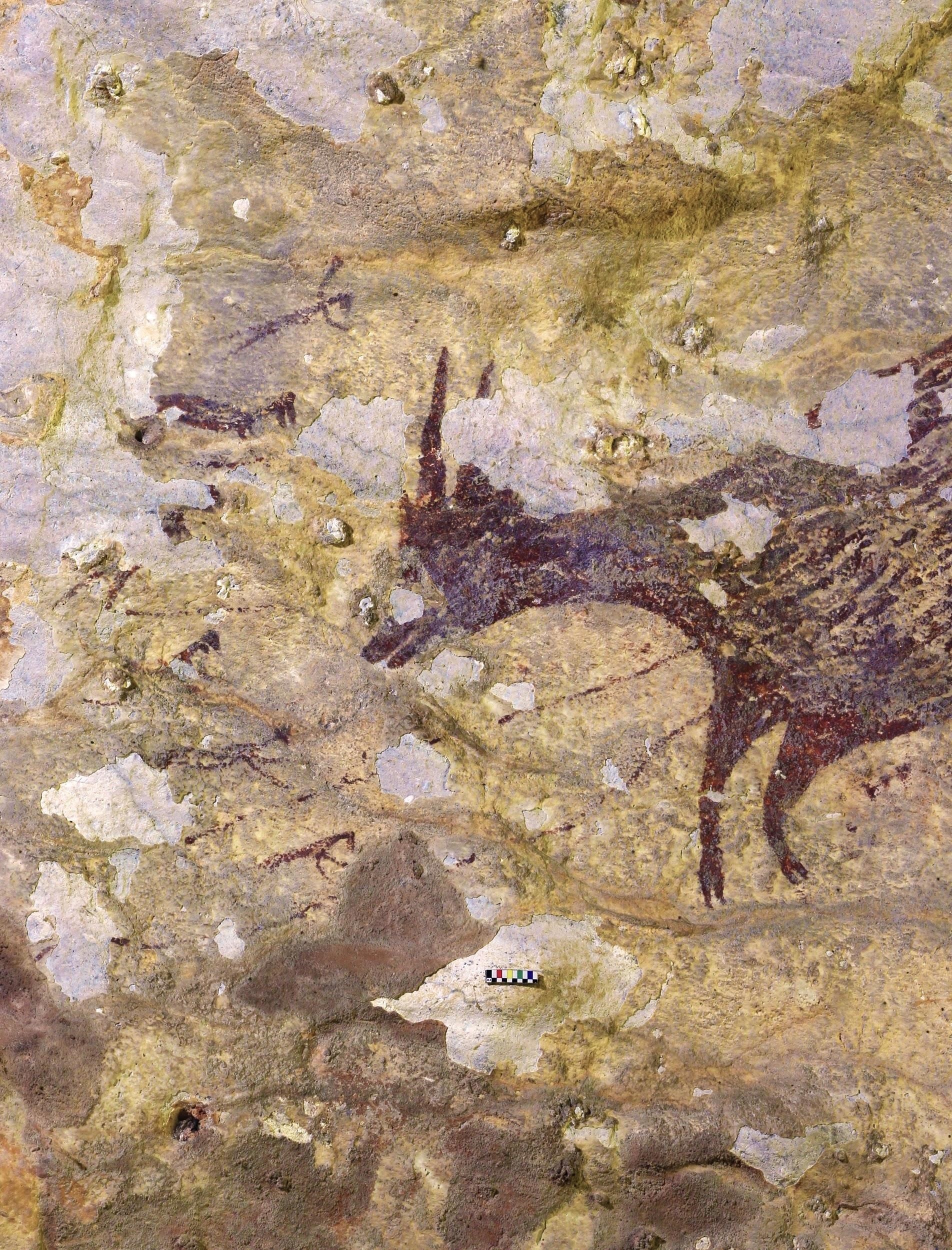 جزء من اللوحة تظهر فيها مبالغة في تصوير حجم الجاموس بينما يحاول الصيادون اصطيادها (مواقع التواصل)