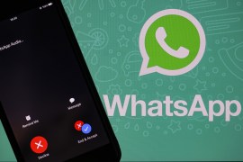 Whatsapp logo- - ANKARA, TURKEY - DECEMBER 03: The logo of Whatsapp is seen near a smartphone in Ankara, Turkey on December 03, 2019.