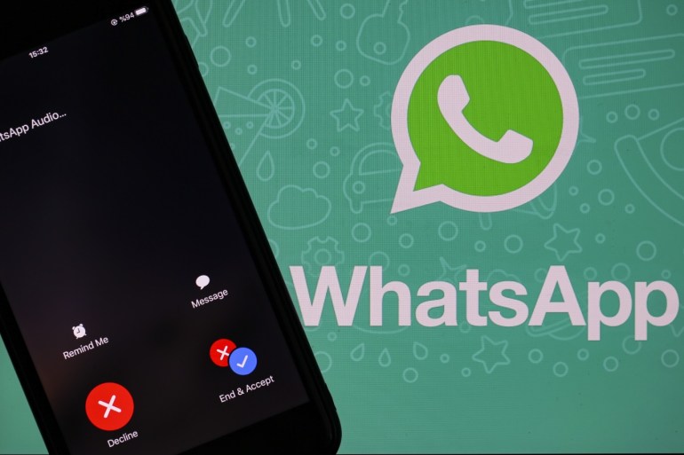 Whatsapp logo- - ANKARA, TURKEY - DECEMBER 03: The logo of Whatsapp is seen near a smartphone in Ankara, Turkey on December 03, 2019.