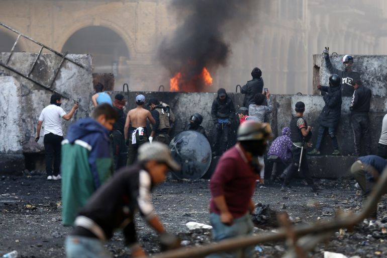 Anti-government protests in Iraq- - BAGHDAD, IRAQ - DECEMBER 05: Protesters clash with the security forces on Al Rasheed Street as they continue anti-government demonstrations after Prime Minister Adel Abdul-Mahdi submitted resignation to parliament, in Baghdad, Iraq on December 05, 2019.