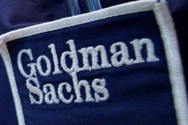 The logo of Dow Jones Industrial Average stock market index listed company Goldman Sachs (GS) is seen on the clothing of a trader working at the Goldman Sachs stall on the floor of the New York Stock Exchange, United States April 16, 2012. REUTERS/Brendan McDermid/File Photo TPX IMAGES OF THE DAY
