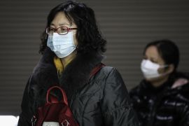 WUHAN, CHINA - JANUARY 9: (CHINA OUT) The women wears a mask while at the subway station on January 9, 2020 in Wuhan, Hubei Province, China. Local authorities have confirmed that a second person in the city has died of a pneumonia-like virus since the outbreak started in December. (Photo by Getty Images)