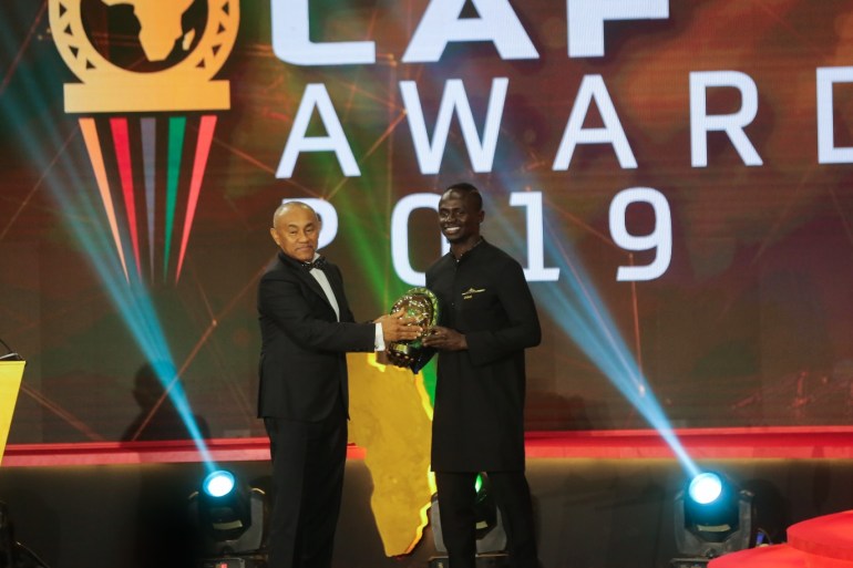 CAF African Player of the Year award- - HURGHADA, EGYPT - JANUARY 7: Liverpool's Senegalese player Sadio Mane receives CAF African Player of the Year award from CAF President Ahmad Ahmad during a ceremony in Hurghada, Egypt on January 7, 2020.