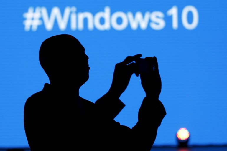 A Microsoft delegate takes a picture during the launch of the Windows 10 operating system in Kenya's capital Nairobi, July 29, 2015. Microsoft Corp's launch of its first new operating system in almost three years, designed to work across laptops, desktop and smartphones, won mostly positive reviews for its user-friendly and feature-packed interface. REUTERS/Thomas Mukoya
