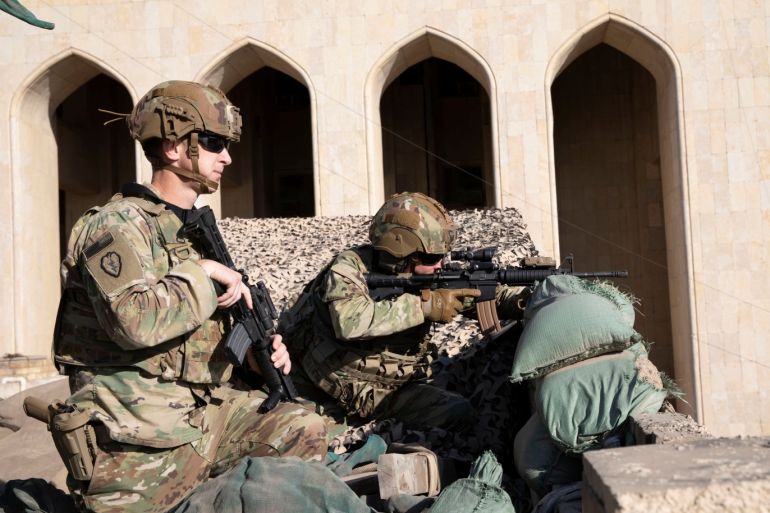 U.S. Army soldiers from 1st Brigade, 25th Infantry Division, Task Force-Iraq, man a defensive position at Forward Operating Base Union III in Baghdad, Iraq, December 31, 2019. U.S. Army/Maj. Charlie Dietz/Task Force-Iraq Public Affairs/Handout via REUTERS. THIS IMAGE HAS BEEN SUPPLIED BY A THIRD PARTY.