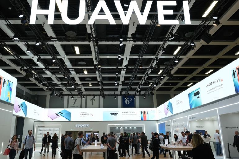 BERLIN, GERMANY - SEPTEMBER 06: Visitors check out new Huawei smartphones and other gadgets at the 2019 IFA home electronics and appliances trade fair on September 06, 2019 in Berlin, Germany. The 2019 IFA fair will be open to the public from September 6-11. (Photo by Sean Gallup/Getty Images)