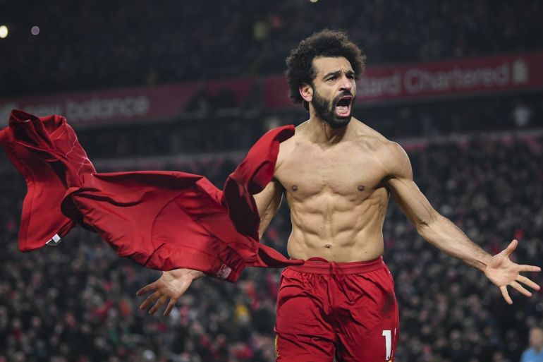 LIVERPOOL, ENGLAND - JANUARY 19: Mohamed Salah of Liverpool celebrates his goal to make it 2-0 during the Premier League match between Liverpool FC and Manchester United at Anfield on January 19, 2020 in Liverpool, United Kingdom. (Photo by Michael Regan/Getty Images)