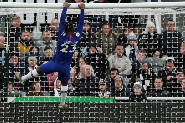 Soccer Football - Premier League - Newcastle United v Chelsea - St James' Park, Newcastle, Britain - January 18, 2020 Chelsea's Michy Batshuayi hangs from the crossbar Action Images via Reuters/Lee Smith EDITORIAL USE ONLY. No use with unauthorized audio, video, data, fixture lists, club/league logos or
