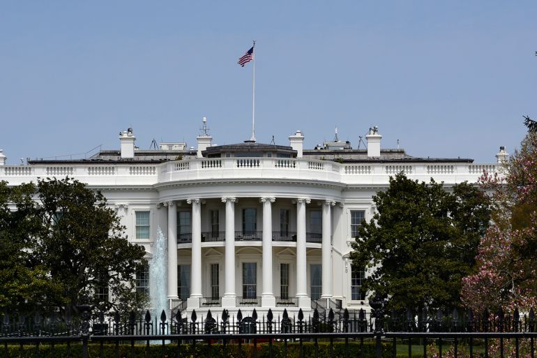 WASHINGTON, D.C. - APRIL 22, 2018: An American flag flies over the south facade of the White House in Washington, D.C. Additional security fences and barriers were added along the south perimeter to prevent people from jumping the fence and entering the restricted White House grounds. The Secret Service tightened the security on the south side in 2017 by closing access to the entire fence line on the South Lawn. (Photo by Robert Alexander/Getty Images)