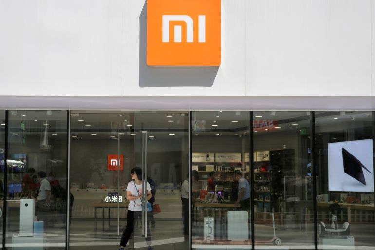 A customer walks out of a Xiaomi store in Beijing, China June 21, 2018. REUTERS/Jason Lee