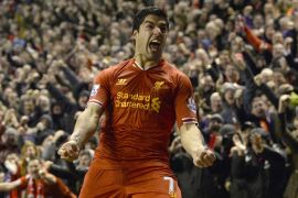 Liverpool's Luis Suarez celebrates after scoring a goal against Everton during their English Premier League soccer match at Anfield in Liverpool, northern England January 28, 2014. REUTERS/Nigel Roddis (BRITAIN - Tags: SPORT SOCCER) FOR EDITORIAL USE ONLY. NOT FOR SALE FOR MARKETING OR ADVERTISING CAMPAIGNS. NO USE WITH UNAUTHORIZED AUDIO, VIDEO, DATA, FIXTURE LISTS, CLUB/LEAGUE LOGOS OR