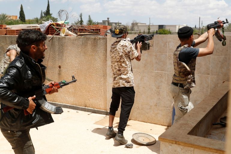Fighters loyal to Libyan internationally recognised government fire guns at forces loyal to Khalifa Haftar outside Tripoli, Libya May 15, 2019. REUTERS/Goran Tomasevic