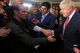 Britain's Prime Minister Boris Johnson shakes hands with supporters during a visit to see newly elected Conservative party MP for Sedgefield, Paul Howell at Sedgefield Cricket Club in County Durham, north east England on December 14, 2019, following his Conservative party's general election victory. Lindsey Parnaby/Pool via REUTERS