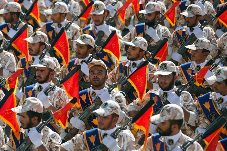 epaselect epa04411795 Iranian Revolutionary Guards march during the annual military parade marking the Iraqi invasion in 1980, which led to a eight-year-long war (1980-1988) in Tehran, Iran, 22 September 2014. The Iranian President said that Iran would not get back even one step of its right about a peaceful nuclear programm. EPA/ABEDIN TAHERKENAREH