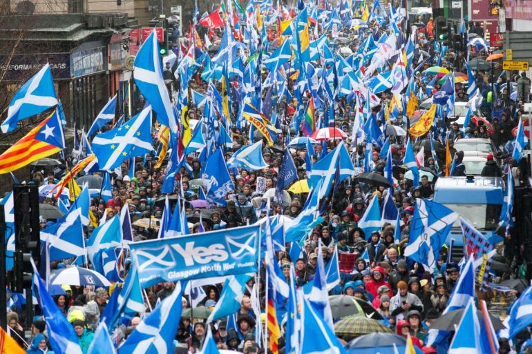 epa08120052 Thousands of campaigners for Scottish independence wave Scottish, Catalonian, Lion Rampant and other flags as they attend the All Under One Banner (AUOB) march through Glasgow, Scotland, Britain, 11 January 2020. According to reports, several thousand supporters of Scottish independence took part in the protest march. EPA-EFE/Robert Perry