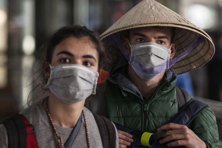 BEIJING, CHINA - JANUARY 30: Foreign tourists walk in the arrivals area at Beijing Capital Airport on January 30, 2020 in Beijing, China. The number of cases of a deadly new coronavirus rose to over 7000 in mainland China Thursday as the country continued to lock down the city of Wuhan in an effort to contain the spread of the pneumonia-like disease which medicals experts have confirmed can be passed from human to human. In an unprecedented move, Chinese authorities put travel restrictions on the city which is the epicentre of the virus and neighbouring municipalities affecting tens of millions of people. The number of those who have died from the virus in China climbed to over 170 on Thursday, mostly in Hubei province, and cases have been reported in other countries including the United States, Canada, Australia, Japan, South Korea, and France. The World Health Organization has warned all governments to be on alert, and its emergency committee is to meet later on Thursday to decide whether to declare a global health emergency. (Photo by Kevin Frayer/Getty Images)