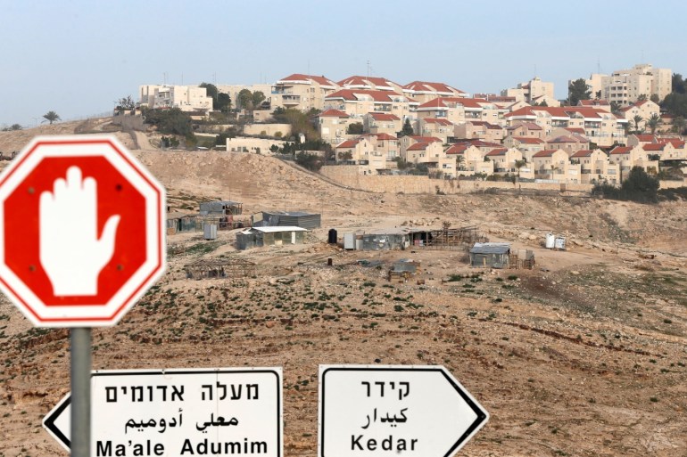 Road signs are seen in front of the Israeli settlement of Maale Adumim in the occupied West Bank, near Jerusalem January 17, 2017. Picture taken January 17, 2017. REUTERS/Ammar Awad