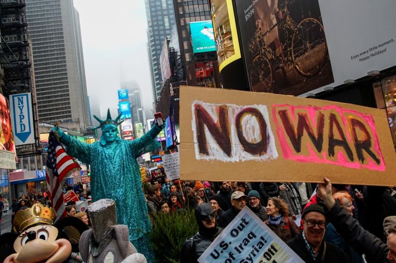 People march as they take part in an anti-war protest amid increased tensions between the United States and Iran at Times Square in New York, U.S., January 4, 2020. REUTERS/Eduardo Munoz