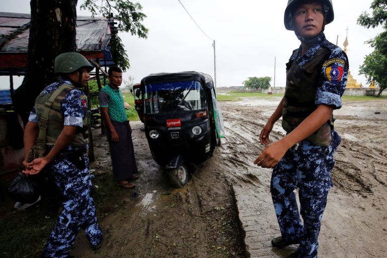 Myanmar police officer stands guard in Maungdaw, Rakhine July 9, 2019. Photo taken on July 9, 2019. REUTERS/Ann Wang