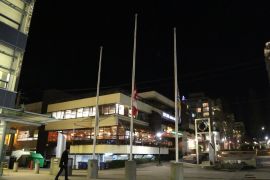 Iran plane crash: Vigil held for victims in Vancouver- - VANCOUVER, CANADA - JANUARY 8 : The Canadian flag hangs at half mast for the victims of a plane crash in Iran, in front of North Vancouver City Hall, B.C., Canada on January 8, 2020.