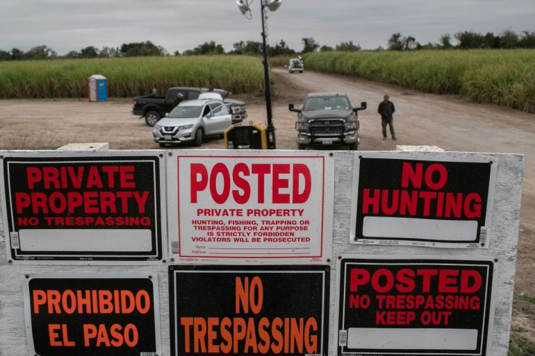 MISSION, TEXAS - DECEMBER 11: Signs stand at the entrance of a construction site where a section of privately-built border wall is being built on December 11, 2019 near Mission, Texas. The hardline immigration group We Build The Wall is funding construction of the wall on private land along the Rio Grande, which forms the border with Mexico. The group, led by former Trump strategist Stephen Bannon claims to have raised tens of millions of dollars in a GoFundMe drive to build sections of wall along stretches of the southwest border with Mexico. John Moore/Getty Images/AFP== FOR NEWSPAPERS, INTERNET, TELCOS & TELEVISION USE ONLY ==