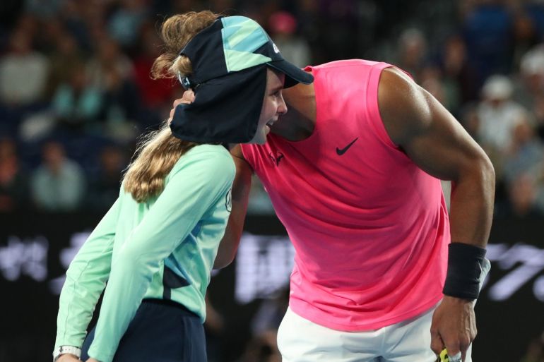 Tennis - Australian Open - Second Round - Melbourne Park, Melbourne, Australia - January 23, 2020. Spain's Rafael Nadal speaks with a ball girl after she is struck with a ball during the match against Argentina's Federico Delbonis. REUTERS/Hannah McKay