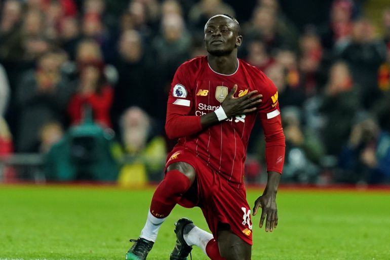 Soccer Football - Premier League - Liverpool v Wolverhampton Wanderers - Anfield, Liverpool, Britain - December 29, 2019 Liverpool's Sadio Mane celebrates scoring their first goal REUTERS/Andrew Yates EDITORIAL USE ONLY. No use with unauthorized audio, video, data, fixture lists, club/league logos or