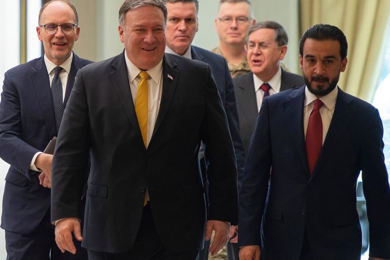U.S. Secretary of State Mike Pompeo walks alongside Iraq's Parliament Speaker Mohammed al-Halbusi in Baghdad, during a Middle East tour, Iraq, January 9, 2019. Andrew Caballero-Reynolds/Pool via REUTERS