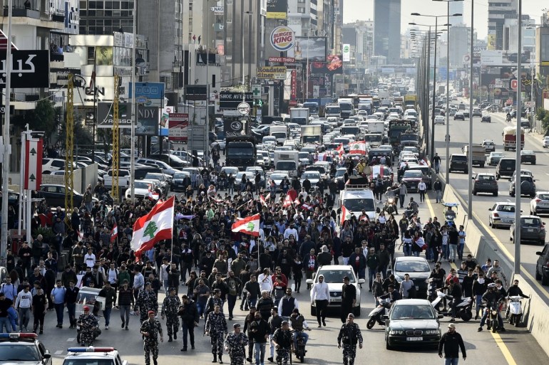 Protests in Lebanon- - BEIRUT, LEBANON - JANUARY 14: Protesters march during ongoing protests against the economic conditions and the lack of solution that government generate for the issue, in Beirut, Lebanon on January 14, 2020.