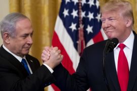 epaselect epa08173197 US President Donald J. Trump (R) shakes hands with Prime Minister of Israel Benjamin Netanyahu while unveiling his Middle East peace plan in the East Room of the White House, in Washington, DC, USA, 28 January 2020. US President Donald J. Trump's Middle East peace plan is expected to be rejected by Palestinian leaders, having withdrawn from engagement with the White House after Trump recognized Jerusalem as the capital of Israel. The proposal was