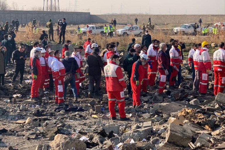 All passengers, crew members killed in Iran plane crash- - TEHRAN, IRAN - JANUARY 08: Search and rescue works are conducted at site after a Boeing 737 plane belonging to a Ukrainian airline crashed near Imam Khomeini Airport in Iran just after takeoff with 180 passengers on board in Tehran, Iran on January 08, 2020. All 167 passengers and nine crew members on an Ukrainian 737 plane that crashed near Iran's capital Tehran early Wednesday have died, according to a state official.
